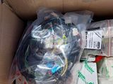 a cardboard box filled with electronic equipment and wires
