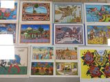 a lot of pictures on the wall of a building