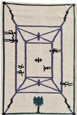 a white rug with a blue and green design on it