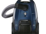 the vacuum is blue and black with a hose attached to it