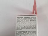 an open box of toothpaste sitting on top of a white table