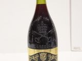 bottle of wine on a white table with a white background