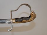 a close up of a sword with a metal handle