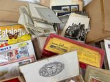 many different types of stamps in a box on the floor