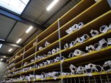 many rolls of toilet paper on the shelves in the warehouse