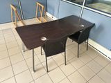 two chairs and a table in a room