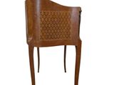 an image of a wooden chair with a carved back and seat