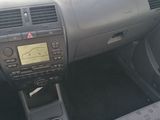 a dashboard of a car with a steering control