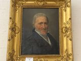 portrait of a man in a blue jacket and white shirt