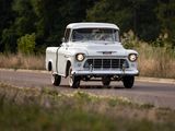 a white truck that is driving down the road