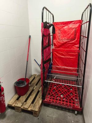 a picture of a small room with a fire extinguisher and a fire hydrant