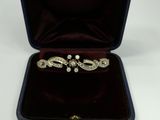 a silver ring in a velvet box on a white surface