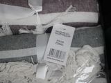 a pile of towels with a tag on it