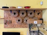 a shelf that has many different types of tools on it