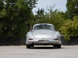 a silver car that is parked in a parking lot