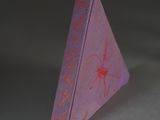 a purple book with writing on it sitting on a table