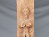 an image of a clay sculpture of a woman holding a child
