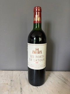 a bottle of wine that is sitting on a table