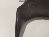 black leather boots on a white table with a pair of black heels