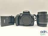 a camera and a lens sitting next to each other on a table