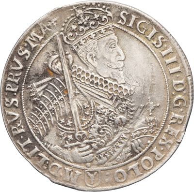 Gros plan sur une pièce d'argent ornée d'une couronne