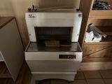 a toaster that is sitting on the floor in the kitchen