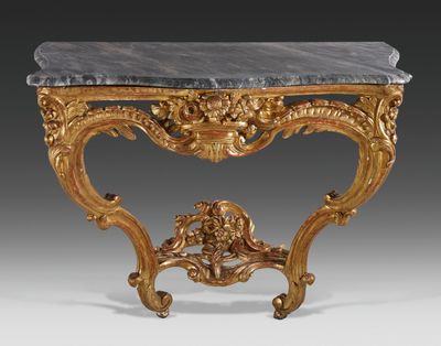 an antique console table with a marble top and gold leaf decoration