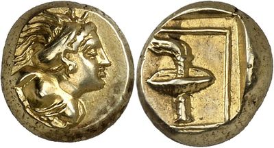 a gold coin with an image of a man holding a bowl