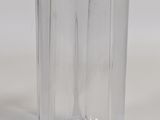 a clear glass vase sitting on a white surface