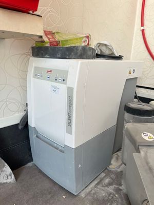 a washing machine in the corner of a room