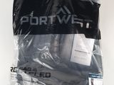 a bag of clothing on a white surface