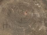 an old stone bowl with a design on it