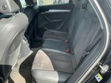 the back seats of a car are empty in a parking lot