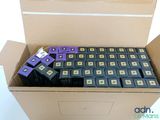 a box full of purple and black batteries in it