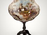 an ornately decorated table with a painting on it