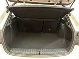 a trunk of a white car with its doors open