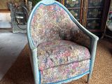a chair that is sitting in the middle of a room