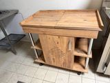 a small wooden table with a shelf on top of it