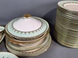 many plates and cups that are stacked on top of each other