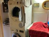 a washer and dryer in a small room