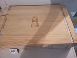a wooden box with a picture of a lighthouse on it