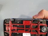 a person holding a cell phone with a red tractor on it