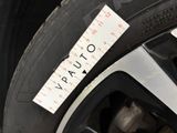 a close up of a tire with a sticker on it