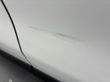 a close up of a car door with a small crack in it