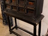 an old wooden cabinet with many drawers on it