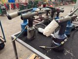 many different types of tools on a table in a warehouse