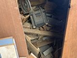 a pile of wood in the corner of a room