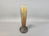 a glass vase that is sitting on a table