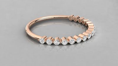 a rose gold wedding band with five diamonds