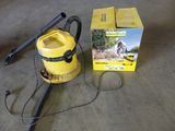 un aspirateur posé sur le sol à côté d'une boîte